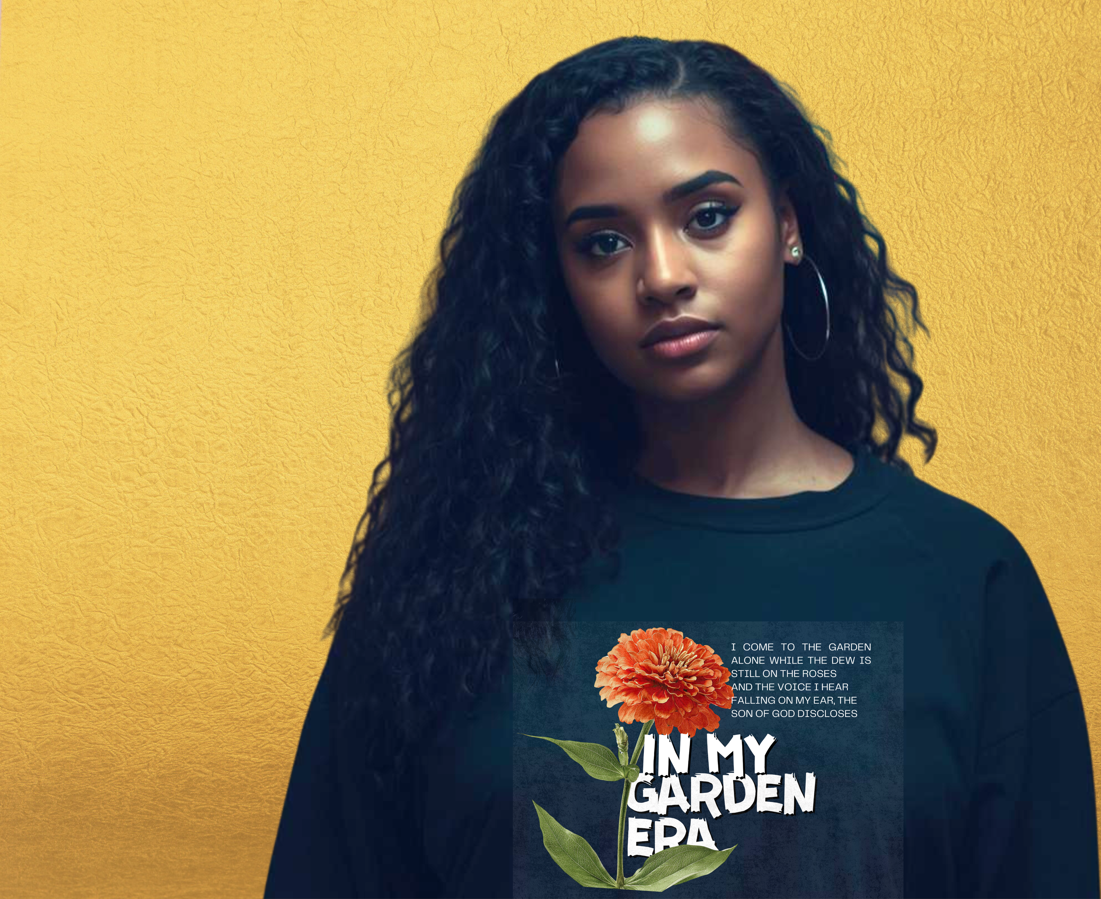 Person wearing a black sweatshirt with a floral design and text " In my Garden Era" on a yellow background